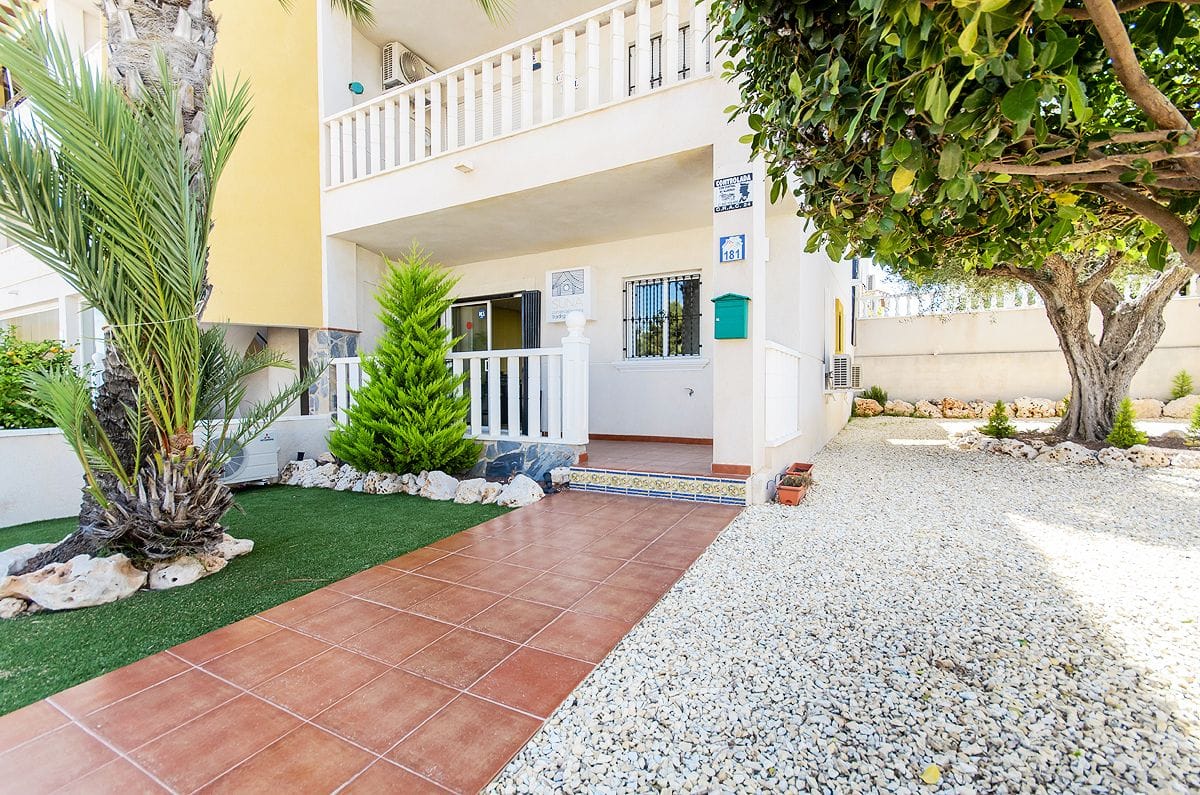 2 bed, 1 bath with large private corner garden and community pool in Villamartín. image 3